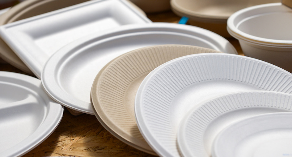 a variety of paper disposable plates of different colors